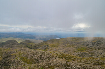 Mountains in the state of Minas Gerais in Brazil. This region is inland and is called Lapinha da Serra and is part of the mountain range called Espinhaco. This mountain range is made up of high peaks,