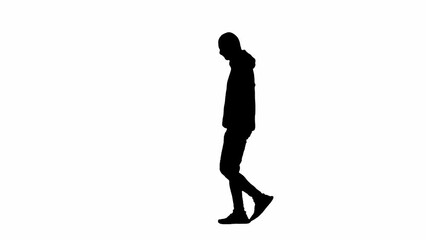 Black silhouette of thief on isolated white background. Male robber in hoodie and balaclava walking, preparing to commit a crime. Side view.