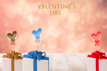 Happy Valentine's day illustration with several colored gift boxes with ribbons and bows on a...