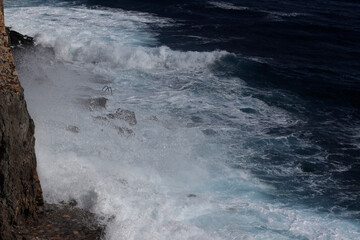 Wave splash on the cliff 
