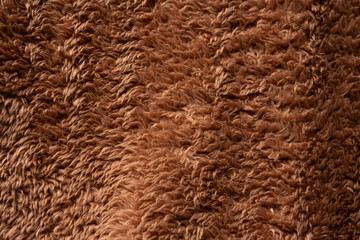 Texture of a brown faux fur as a background.