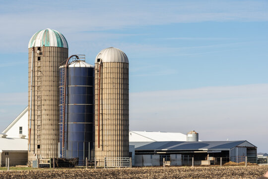 Old farm buildings, including grain silos and barns, in rural Livingston county.  Illinois, USA.