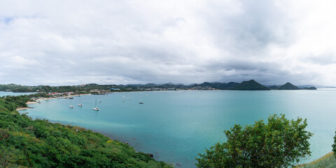 Fototapeta na wymiar A panorama of yachts anchored in Rodney Bay in St Lucia viewed from Pigeon Island.