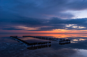 Fototapeta premium Sunset or sunrise sky clouds over water. Beautiful nature landscape.