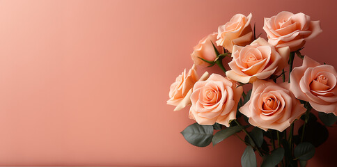 Obraz na płótnie Canvas Bouquet of peach roses against solid background. Image for a wedding, women's day or mother's day themed greeting card or invitation. Banner with space for text
