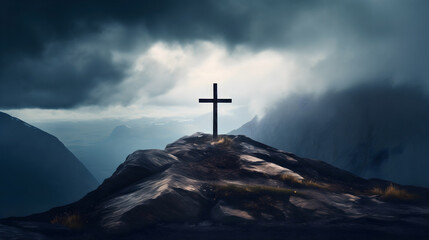 Wooden cross silhouette on rocky mountain top or peak, dark clouds on the sky. Christian faith or...