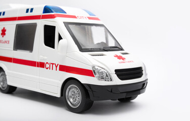 Toy ambulance on a white background. Healthcare concept