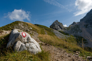 Path to the mount Mangart (2679m). Access to the summit is quite short since road runs more than 2000 meters high. To the peak leads "Slovenian" and "Italian" path.