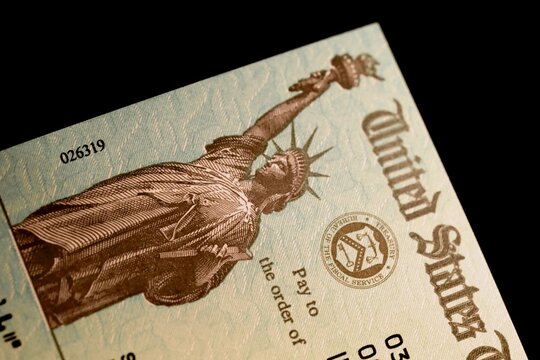 IRS check for tax refunds - checks are issued from the treasury department and have a distinctive Statue of Liberty image.