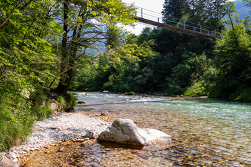 Bridge over beautiful Soca River in Bovec, Triglav National Park, Slovenia. Magnificent Soca Valley...