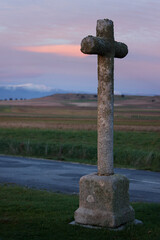 Fototapeta na wymiar stone cross with dramatic sky