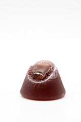 Closeup of cuberdon, a cone-shaped Belgian candy on a white background