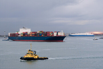 Loaded Large Container Ship Entering The Port With Dense Navigation Traffic Under Assistance Of The...