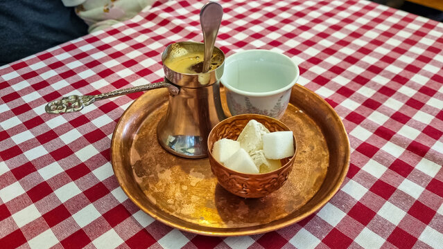 Bosnian Coffee Pot, also known as Dzezva. A Dzezva, or cezve is a pot designed specifically to make Turkish or Bosnian coffee. Served in traditional restaurant in Maribor, Slovenia