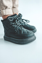 Stylish fashionable black children's shoes, close-up