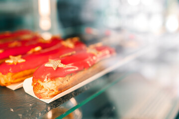 Freshly baked eclairs on display in a cafe