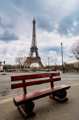 Paris, empty bench with Eiffel tower in the background - 702985700