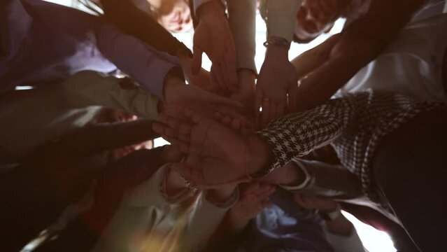 Many hands together, group of joining hands