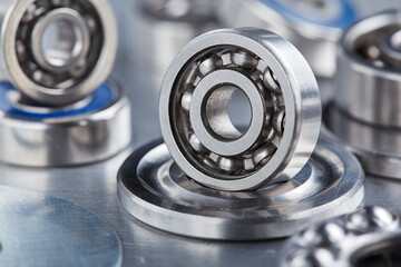 Obraz premium different bearings on a metal background. Part of mechanism.