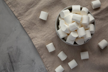 White Marshmallows in a Bowl, top view. Flat lay, overhead, from above. Copy space.