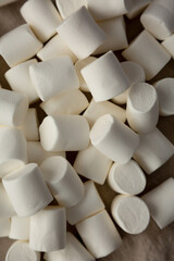 White Marshmallows on cloth, top view. Flat lay, overhead, from above.