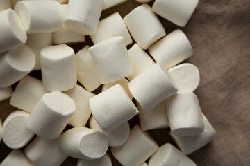 White Marshmallows on cloth, top view. Flat lay, overhead, from above.