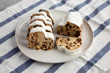 Homemade Christmas Stollen Bread on a Plate, side view.