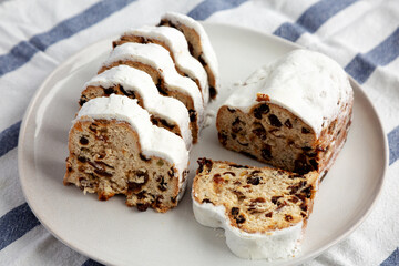 Homemade Christmas Stollen Bread on a Plate, side view. Close-up.