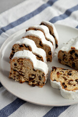Homemade Christmas Stollen Bread on a Plate, side view.