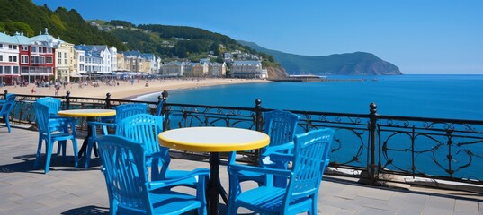 Fototapeta premium Coastal promenade with cafes, umbrellas, and bicycles for outdoor dining and leisure activities