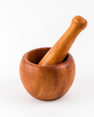 Wooden mortar and pestle on white background - 702998343