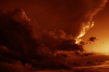 Red orange gold yellow cloudy sky. Black dark storm ominous clouds. Night evening sunset sun light....