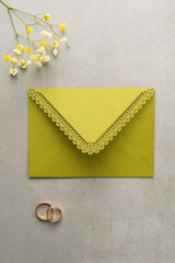 Wedding background with olive green greeting envelope - 702999338