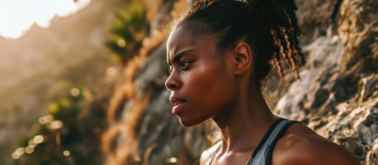 Exhausted black woman engaged in outdoor cardio workout, experiencing physical strain and discomfort from challenging mountain running exercise. - obrazy, fototapety, plakaty