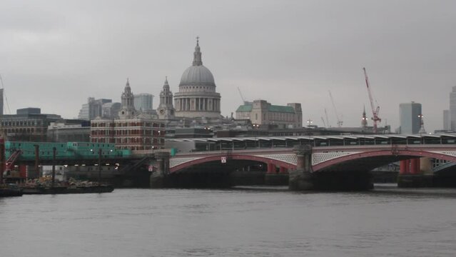 millenium bridge and St.Pauls cathedral skyline view across the Thames river, London uk  stock, footage, video, clip