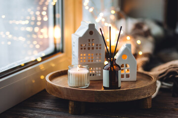 Christmas home aromatherapy. Aroma diffuser with organic essential oil, cinnamon, anise, vanilla...