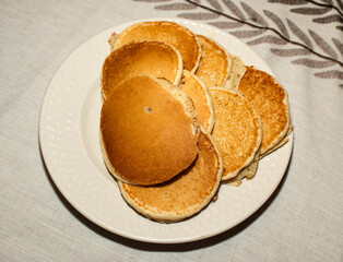 A plate of pancakes on a table 