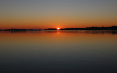 Fototapeta na wymiar peaceful sunset on the lake