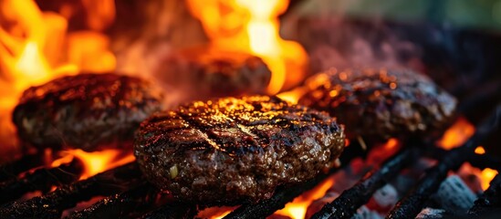 Grilling burgers: cooking beef on the grill.