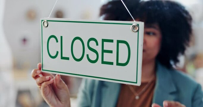 Woman, closed sign and boutique door with smile, notification and message with board in shopping mall. African designer girl, small business owner and happy with poster, signage or news at storefront