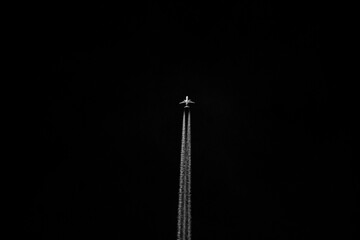 Airliner in the sky. Black and white photo of airplane.