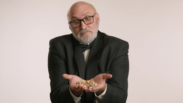 An elderly fox in glasses and a tuxedo, discontentedly showing many pills in his palms, emphasizing the need for self-care and treatment at this age. The man stands against a white background. 8K RAW.