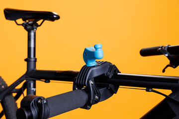 Photo focus on repair-stand clamp used for securing bicycle body for adjustments. Close-up shot of damaged bike placed and supported on workstand. Maintenance and service for optimal cycling. - obrazy, fototapety, plakaty