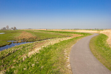 Fototapeta na wymiar Bicycle path in the nature area Purmerland, Netherlands