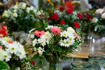 Obraz na płótnie Canvas Flowers for sale at the flower shop. Luxury bouquets for sale at a flower shop.