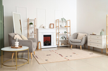 Modern fireplace with shelving units and armchairs in living room