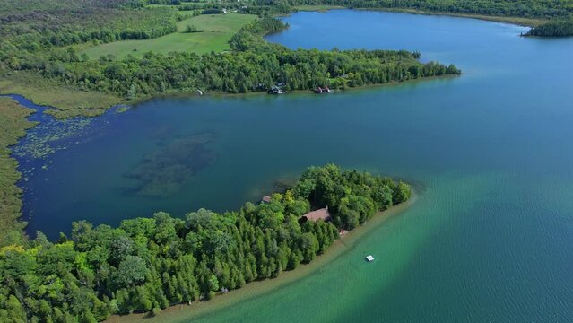 Magnificent aerial view of calm and charming waters and wetlands of Lake Manitou. Luxury view of Manitoulin Island vegetation in Northern Ontario, Canada. Largest lake on the island.