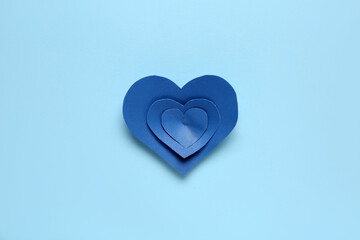 Paper hearts on blue background. Valentines Day celebration