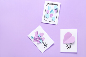 Beautiful greeting cards for Valentine's Day celebration on lilac background