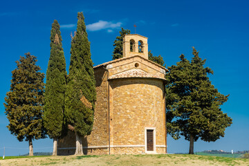 Naklejka premium Chapel with cypresses in the middle of the field, Cappella Madonna di Vitaleta, Siena, Tuscany, Italy